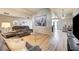 Open living room with wood flooring and a skylight window at 2496 Golfers St, Las Vegas, NV 89142