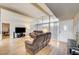 Bright living room featuring wood floors and skylight-style windows at 2496 Golfers St, Las Vegas, NV 89142