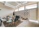 Enclosed patio with plenty of seating, decor, and a punching bag, provides an excellent recreational area at 2496 Golfers St, Las Vegas, NV 89142