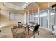 Enclosed patio with a heater, ample seating, and a skylight offers a relaxing indoor-outdoor experience at 2496 Golfers St, Las Vegas, NV 89142