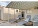 Covered patio area featuring chaise lounges, side table, grill, and storage shed at 2496 Golfers St, Las Vegas, NV 89142