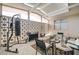 Bright, airy enclosed patio with comfortable seating and decor, creates a versatile outdoor space for relaxing at 2496 Golfers St, Las Vegas, NV 89142