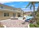 Enjoy this brick patio, grill, built-in spa, and refreshing pool in this backyard retreat at 2555 Antique Blossom Ave, Henderson, NV 89052
