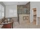 Elegant bathroom featuring a copper soaking tub, stone shower with glass enclosure, and white shutters at 2555 Antique Blossom Ave, Henderson, NV 89052