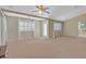 Large bonus room with plenty of windows and carpet at 2555 Antique Blossom Ave, Henderson, NV 89052