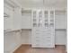 Walk-in closet with white shelving, drawers, and ample storage space for an organized wardrobe at 2555 Antique Blossom Ave, Henderson, NV 89052