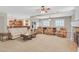 Expansive living area with open layout to the kitchen, fireplace, and abundant natural light at 2555 Antique Blossom Ave, Henderson, NV 89052