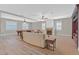 Spacious living room with a fireplace, pool table, and custom built-ins at 2555 Antique Blossom Ave, Henderson, NV 89052