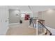Spacious loft area with office setup and access to upstairs bedrooms at 2555 Antique Blossom Ave, Henderson, NV 89052
