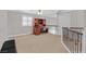 Loft with built in desk and chair with stairs leading to first floor at 2555 Antique Blossom Ave, Henderson, NV 89052