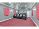 Relax in this theater room complete with a large screen, ceiling fan, and comfortable seating at 2555 Antique Blossom Ave, Henderson, NV 89052