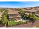 This aerial view shows the pool, outdoor kitchen, landscaping, and privacy at 2577 Luberon Dr, Henderson, NV 89044