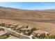 Beautiful aerial view of luxurious homes with desert landscape and mountain backdrop at 2577 Luberon Dr, Henderson, NV 89044