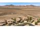Nice aerial view of desert community with tile roof homes and mountain backdrop at 2577 Luberon Dr, Henderson, NV 89044