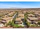 Panoramic view of a community of tile roof homes, with city views in the background at 2577 Luberon Dr, Henderson, NV 89044
