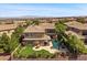 An entertainer's backyard with a pool, spa, outdoor kitchen and lush landscaping at 2577 Luberon Dr, Henderson, NV 89044
