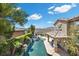 Aerial view showcases a backyard with pool, water feature, and outdoor kitchen at 2577 Luberon Dr, Henderson, NV 89044