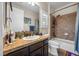 Hall bathroom with tub and shower combo and shuttered window at 2577 Luberon Dr, Henderson, NV 89044