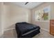 This bedroom features neutral walls, a ceiling fan, and bright natural lighting at 2577 Luberon Dr, Henderson, NV 89044
