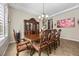 Beautiful dining room with decorative hutch and ornate chandelier at 2577 Luberon Dr, Henderson, NV 89044