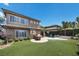 Home exterior with a patio, BBQ, artificial grass, and a view of the spa and pool at 2577 Luberon Dr, Henderson, NV 89044