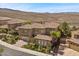 A beautifully landscaped home boasts a three-car garage and desert views at 2577 Luberon Dr, Henderson, NV 89044