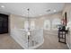 Bright hallway with white railings, recessed lighting, and window shutters at 2577 Luberon Dr, Henderson, NV 89044