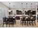 Open-concept kitchen and dining area with dark wood cabinetry, stainless appliances, and ample counter space at 2577 Luberon Dr, Henderson, NV 89044
