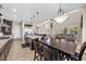 Expansive kitchen and dining area boasts modern appliances, an island, and seamless flow into the living space at 2577 Luberon Dr, Henderson, NV 89044