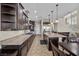 Gourmet kitchen with granite counters, stainless appliances, and an open layout flowing into the dining area at 2577 Luberon Dr, Henderson, NV 89044