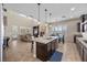 Bright and open kitchen and living area features modern appliances, plenty of light, and comfortable seating at 2577 Luberon Dr, Henderson, NV 89044