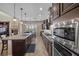 Modern kitchen featuring stainless steel appliances, granite countertops, and a gas cooktop at 2577 Luberon Dr, Henderson, NV 89044
