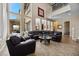 Spacious living room boasting abundant natural light, high ceilings, and a comfortable seating arrangement at 2577 Luberon Dr, Henderson, NV 89044