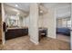 Main bathroom with dual vanities, tiled floors, and a vanity area at 2577 Luberon Dr, Henderson, NV 89044