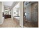 Spacious main bathroom with walk-in shower, jetted tub, and dual sink vanity at 2577 Luberon Dr, Henderson, NV 89044
