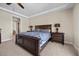 Main bedroom with tray ceilings, recessed lighting, and matching furniture at 2577 Luberon Dr, Henderson, NV 89044