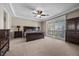 Spacious main bedroom with a ceiling fan and shuttered windows for natural light at 2577 Luberon Dr, Henderson, NV 89044