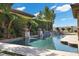 Inviting pool with water features and lush landscaping creates a private backyard oasis at 2577 Luberon Dr, Henderson, NV 89044