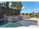 Backyard pool and spa with beautiful greenery and mature trees at 2577 Luberon Dr, Henderson, NV 89044