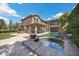 Beautiful backyard with a pool, spa, and outdoor kitchen perfect for entertaining guests at 2577 Luberon Dr, Henderson, NV 89044