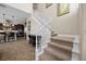 Elegant staircase leading to the upper level and open kitchen at 2577 Luberon Dr, Henderson, NV 89044