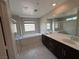 Bright bathroom features dual sinks, soaking tub and glass enclosed shower at 2620 Tolmezzo St, Henderson, NV 89044