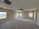 Spacious bedroom with carpet, a ceiling fan, and plenty of windows for natural light at 2620 Tolmezzo St, Henderson, NV 89044