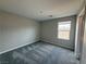 Bedroom with plush carpet and neutral colored walls at 2620 Tolmezzo St, Henderson, NV 89044