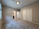 Carpeted bedroom featuring closet and ensuite bathroom providing comfort and privacy at 2620 Tolmezzo St, Henderson, NV 89044