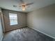 Neutral bedroom with a window offering natural light and comfortable carpeting, ready for personalization at 2620 Tolmezzo St, Henderson, NV 89044
