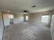Large carpeted bedroom with a ceiling fan, recessed lighting, and three windows at 2620 Tolmezzo St, Henderson, NV 89044