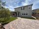 Two-story house featuring a covered patio, stone block yard, and neutral gray paint at 2620 Tolmezzo St, Henderson, NV 89044