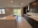Beautiful kitchen with an island, stainless steel appliances, a gas cooktop, and backyard access at 2620 Tolmezzo St, Henderson, NV 89044