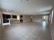 Open-concept living space showcases tile flooring and kitchen access, perfect for entertaining at 2620 Tolmezzo St, Henderson, NV 89044